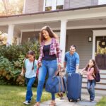 Family leaving for a trip after completing vacation home safety checklist