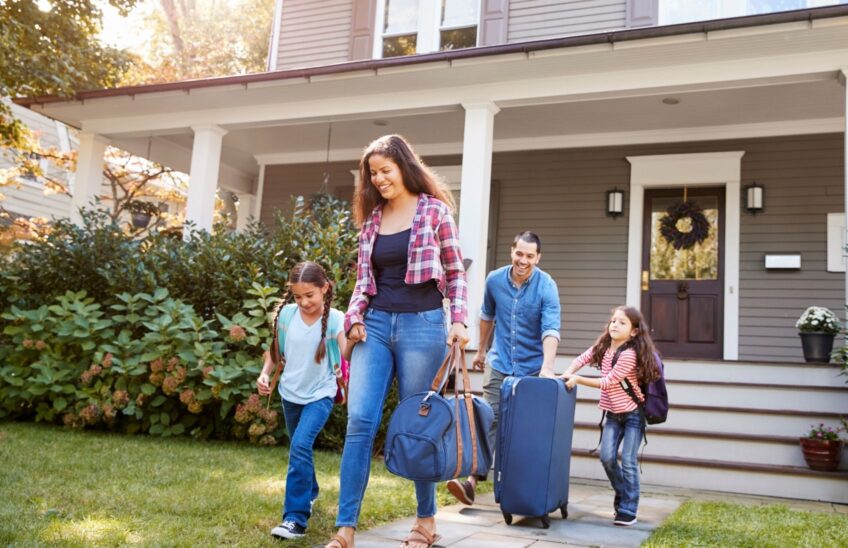 Family leaving for a trip after completing vacation home safety checklist
