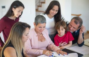 Family organizing important emergency documents in a home office.