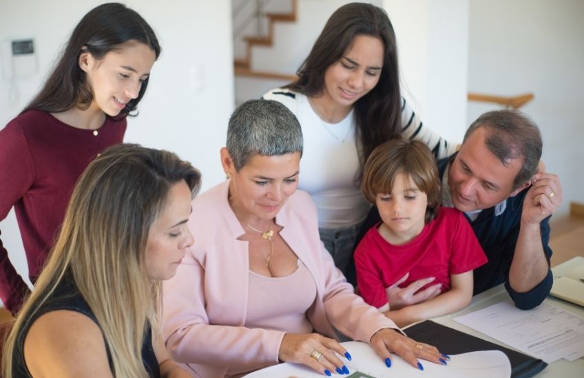 Family organizing important emergency documents in a home office.