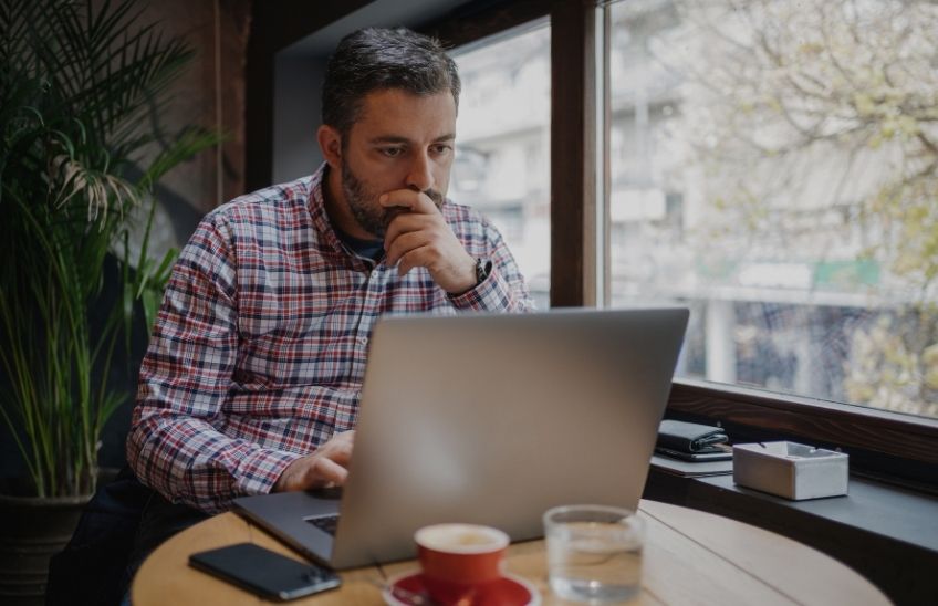 Small business owner reviewing a continuity plan while the business is temporarily closed